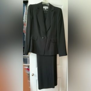 Black 2 piece pants suit. One button blazer.